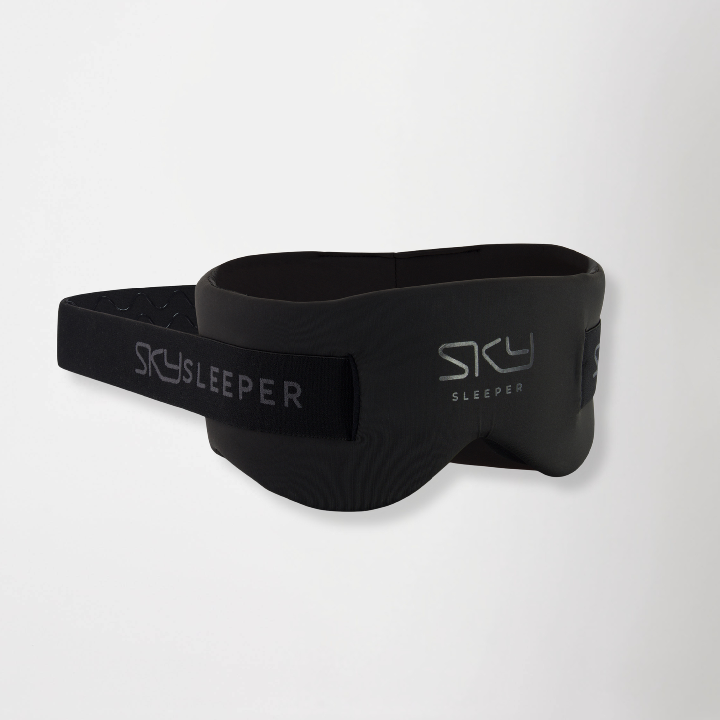SkySleeper™ 360° travel sleep mask with adjustable strap on white background